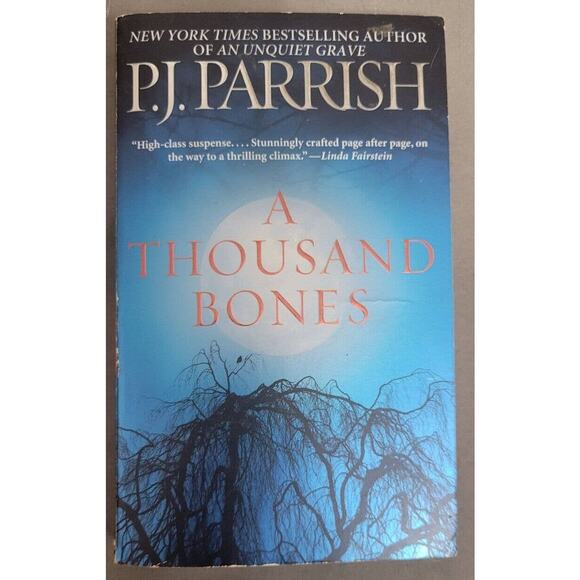 A Thousand Bones P.J. Parrish Book Paperback - Picture 1 of 1